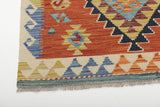 Orientmattor Kelim Chobi 64683 rug with intricate geometric patterns and warm earthy tones, detailed woven textile.