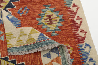 Orientmattor Kelim Chobi 64683 rug with intricate geometric patterns and warm earthy tones, showing detailed woven texture.