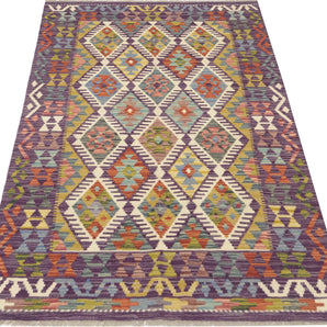 Colorful Orientmattor Kelim Chobi 64716 rug with intricate geometric patterns and vibrant shades, showcasing traditional craftsmanship.
