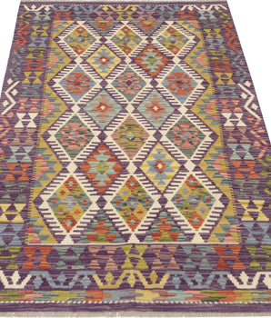 Colorful Orientmattor Kelim Chobi 64716 rug with intricate geometric patterns and vibrant shades, showcasing traditional craftsmanship.