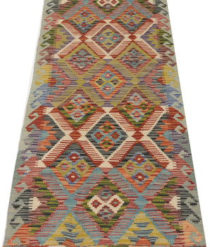 Orientmattor Kelim Chobi 64737 rug with intricate geometric patterns in warm earthy tones, woven with traditional craftsmanship.