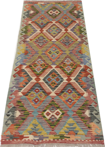 Orientmattor Kelim Chobi 64737 rug with intricate geometric patterns in warm earthy tones, woven with traditional craftsmanship.