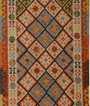 Kelim-Chobi 64743 Kelim rug by Orientmattor with intricate geometric patterns in warm earthy tones.