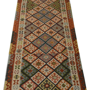 Orientmattor Kelim Chobi 64743 rug with intricate geometric patterns and warm earthy tones, traditional handwoven design.