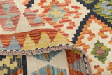 Colorful Orientmattor Kelim Chobi 64743 rug with intricate geometric patterns and vibrant woven details on a neutral background.