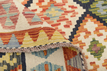Colorful Orientmattor Kelim Chobi 64743 rug with intricate geometric patterns and vibrant woven details on a neutral background.