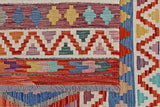 Kelim-Chobi 64896 by Orientmattor, showcasing intricate geometric patterns and warm earthy tones in a vibrant weave.