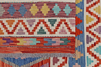 Kelim-Chobi 64896 by Orientmattor, showcasing intricate geometric patterns and warm earthy tones in a vibrant weave.