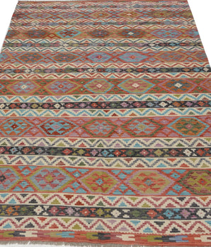 Orientmattor Kelim Chobi 64909 rug with intricate geometric patterns, handmade wool design in warm earthy tones.