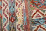 Orientmattor Kelim Chobi 64909 rug with intricate patterns, traditional design, and warm earthy tones on a woven textile background.