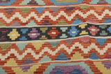 Orientmattor Kelim Chobi 64921 with traditional woven pattern, detailed geometric motifs, and earthy tones on a neutral background.