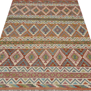 Orientmattor Kelim Chobi rug with intricate patterns and warm earthy tones, showcasing traditional handwoven craftsmanship.