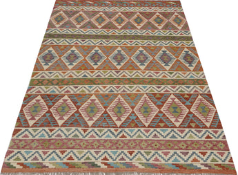Orientmattor Kelim Chobi rug with intricate patterns and warm earthy tones, showcasing traditional handwoven craftsmanship.