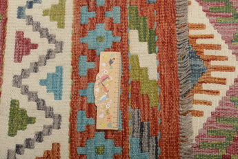 Orientmattor Kelim Chobi 64960 rug with intricate geometric patterns and warm earthy tones in a traditional woven design.