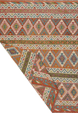 Orientmattor Kelim Chobi rug featuring traditional geometric patterns in warm earthy tones.