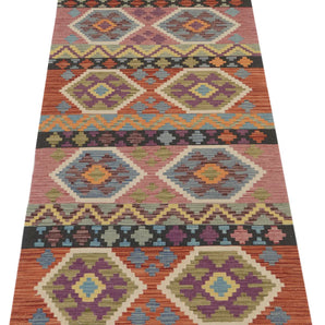 Orientmattor Kelim Chobi 64964 rug with intricate geometric patterns and warm earthy tones, woven with traditional craftsmanship.