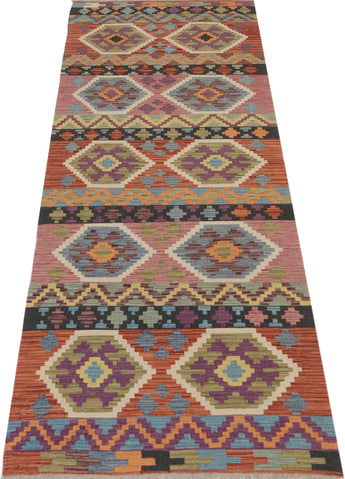 Orientmattor Kelim Chobi 64964 rug with intricate geometric patterns and warm earthy tones, woven with traditional craftsmanship.