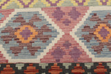 Orientmattor Kelim Chobi 64964 rug with intricate geometric patterns and warm earthy colors, showcasing traditional craftsmanship.