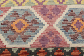 Orientmattor Kelim Chobi 64964 rug with intricate geometric patterns and warm earthy colors, showcasing traditional craftsmanship.