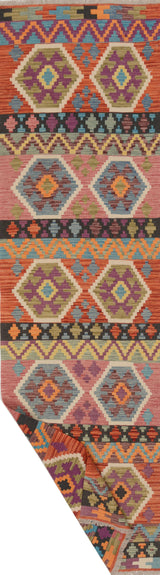 Colorful Orientmattor Kelim Chobi 64964 rug with intricate patterns and vibrant hues, showcasing traditional craftsmanship.
