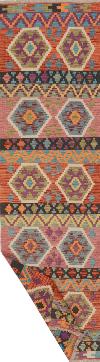 Colorful Orientmattor Kelim Chobi 64964 rug with intricate patterns and vibrant hues, showcasing traditional craftsmanship.