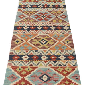 Kelim-Chobi 64967 by Orientmattor featuring intricate patterns and warm colors, showcasing a beautiful textile design.