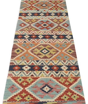 Kelim-Chobi 64967 by Orientmattor featuring intricate patterns and warm colors, showcasing a beautiful textile design.