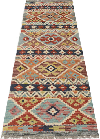 Kelim-Chobi 64967 by Orientmattor featuring intricate patterns and warm colors, showcasing a beautiful textile design.