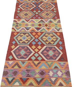 Orientmattor Kelim Chobi rug with intricate geometric patterns, featuring warm earthy tones and traditional handwoven design.