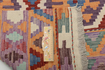 Colorful Kelim Chobi rug with intricate geometric patterns from Orientmattor, showcasing traditional craftsmanship and vibrant design.