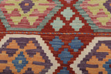 Orientmattor Kelim Chobi 64972 rug with intricate geometric patterns in warm earthy tones, handmade woven textile for home decor.