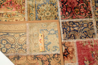 Colorful patchwork rug with intricate pattern from Orientmattor, featuring a mix of vibrant fabric patches and detailed stitching.