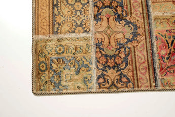 Colorful patchwork rug with intricate patterns from Orientmattor, featuring a mix of vibrant fabrics and detailed stitching.