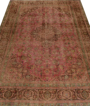 Stonewashed Orientmattor rug with soft, faded fabric in a light, neutral tone, shown in close-up detail.