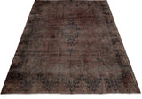 Orientmattor Vintage 61003 rug featuring intricate patterns and rich colors on a soft textured surface.