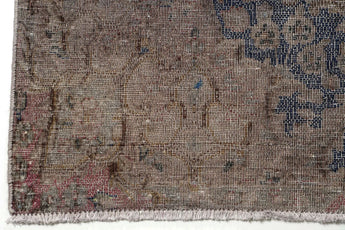 Orientmattor Vintage 61003 rug showcasing intricate patterns and rich colors on a textured surface.