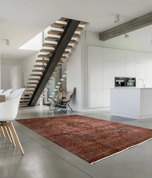 Orientmattor Vintage 63183 rug featuring intricate patterns and rich colors, beautifully displayed on a wooden floor.