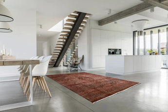 Orientmattor Vintage 63183 rug featuring intricate patterns and rich colors, beautifully displayed on a wooden floor.