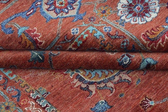 Orientmattor Ghazni 64979 Ziegler/Kazak rug with intricate geometric patterns in warm tones, detailed close-up of woven textile