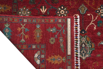 Orientmattor Ariana Oriental handwoven Ziegler/Kazak rug, 239x174 cm with intricate patterns and rich colors, on a flat surface.