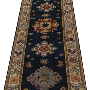 Kazak-Super 64579 Ziegler/Kazak rug by Orientmattor with intricate geometric patterns and vibrant colors on a woven surface.