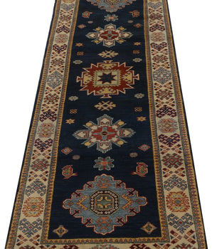 Kazak-Super 64579 Ziegler/Kazak rug by Orientmattor with intricate geometric patterns and vibrant colors on a woven surface.