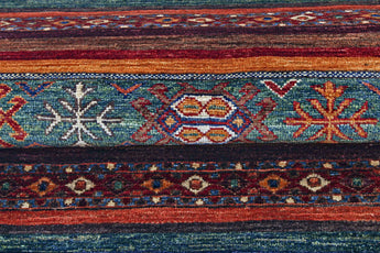 Orientmattor Khorjin 64862 Ziegler/Kazak rug featuring intricate geometric patterns and vibrant colors on a woven textile.