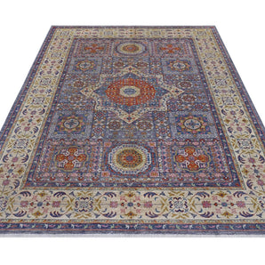 Orientmattor Mamlook 64992 Ziegler/Kazak rug with intricate geometric patterns and warm earthy tones on a woven textile background.