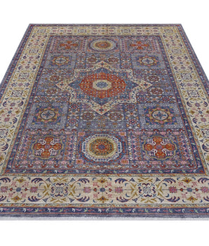 Orientmattor Mamlook 64992 Ziegler/Kazak rug with intricate geometric patterns and warm earthy tones on a woven textile background.